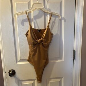 Tan Bodysuit with Plunging V-Neckline and High-Cut Legs